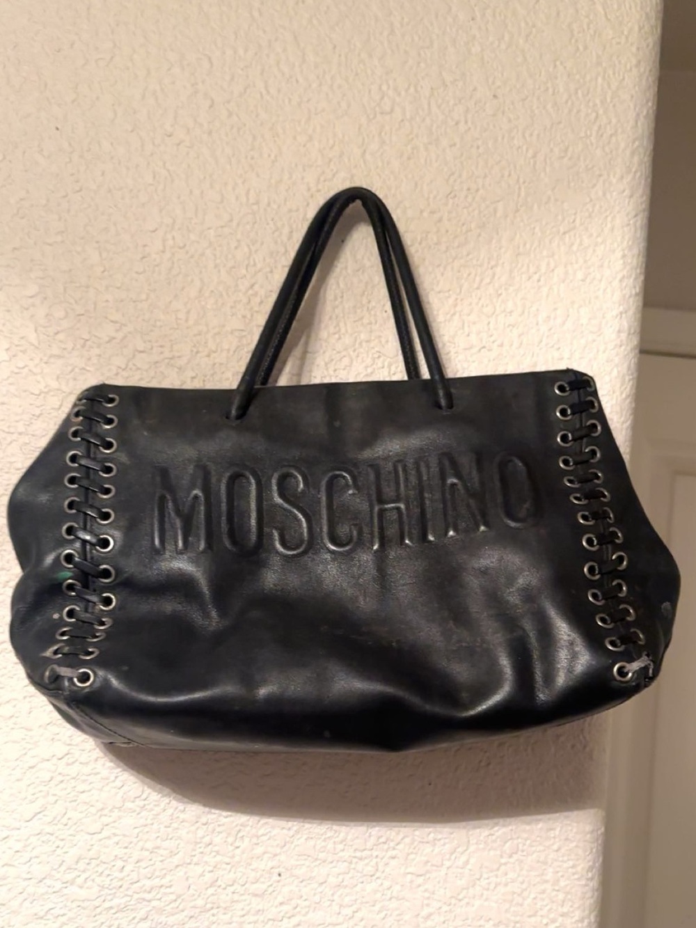 Authentic Designer Moschino Black Embossed Logo Lace-Up Leather Tote.